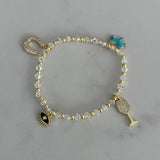 Charm Bracelet: Horse shoe, Pony (aqua), Evil eye (black), Wine glass